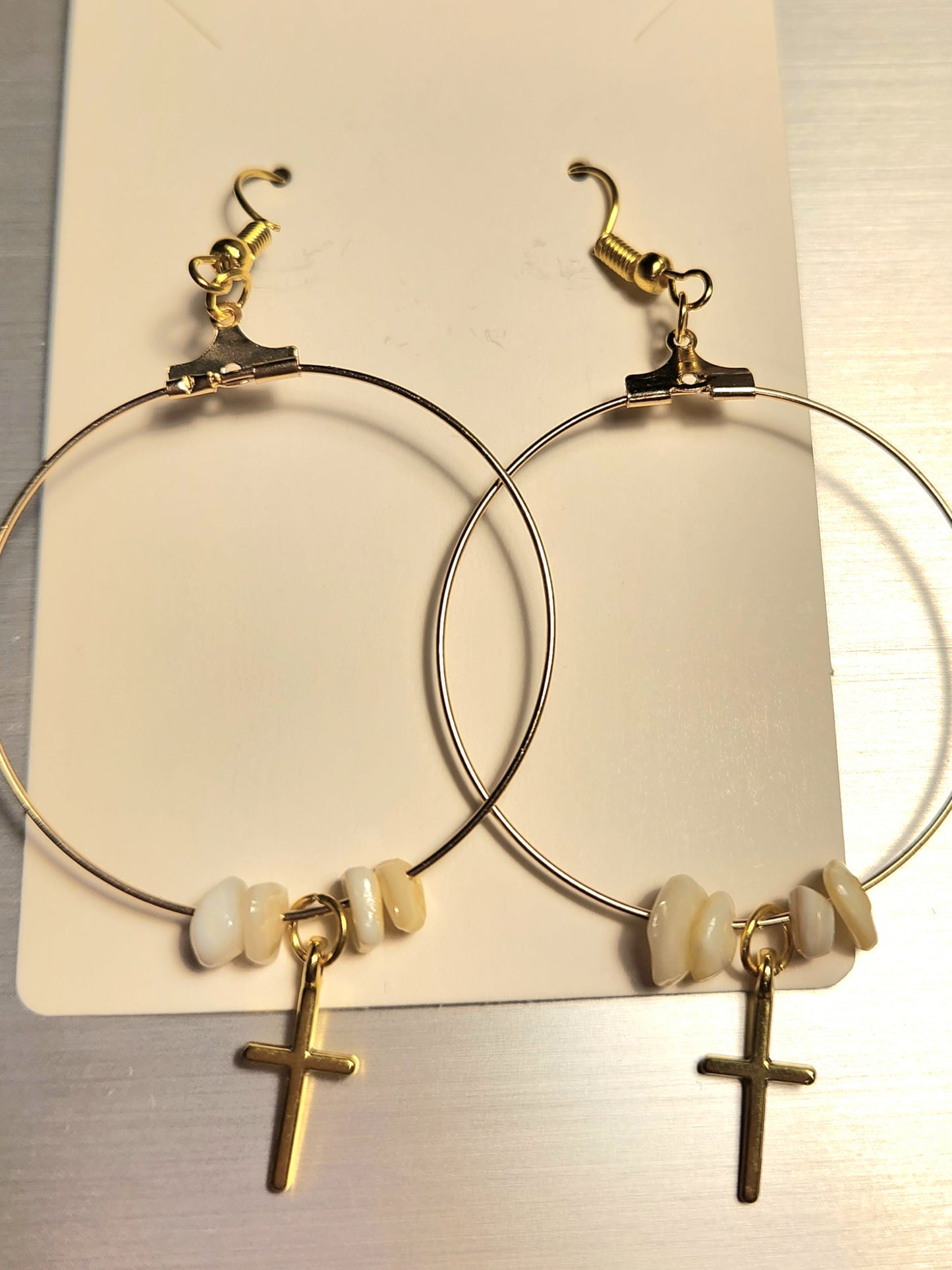 Gold Colored Cross Hoop Earrings With Beige Colored Rocks