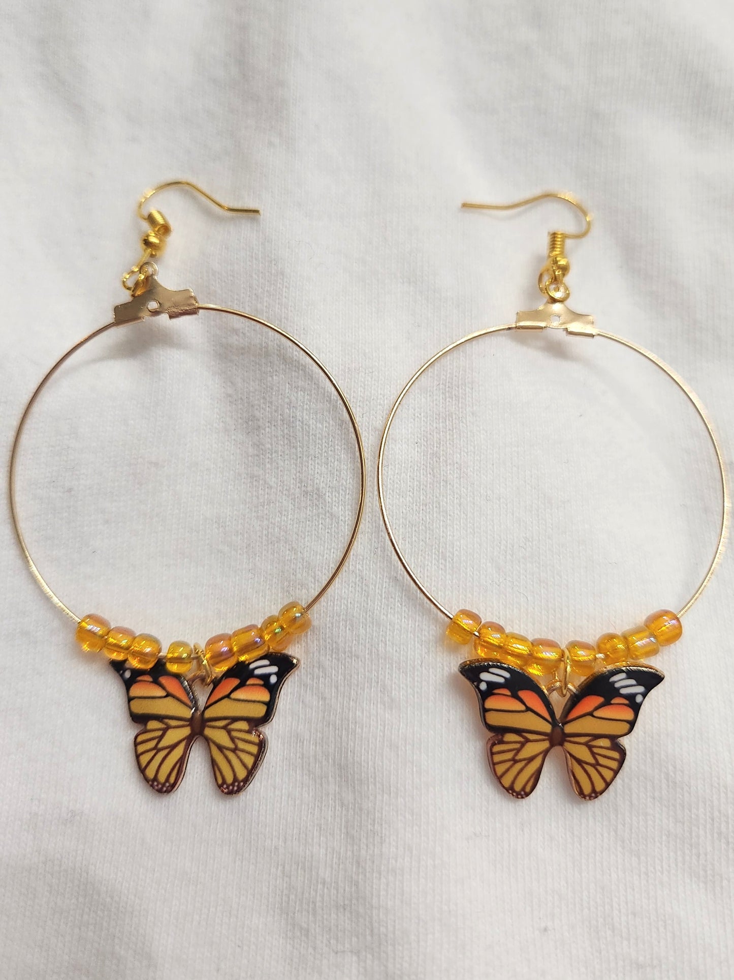 Gold Colored Butterfly Hoop Earrings with Yellow Beads