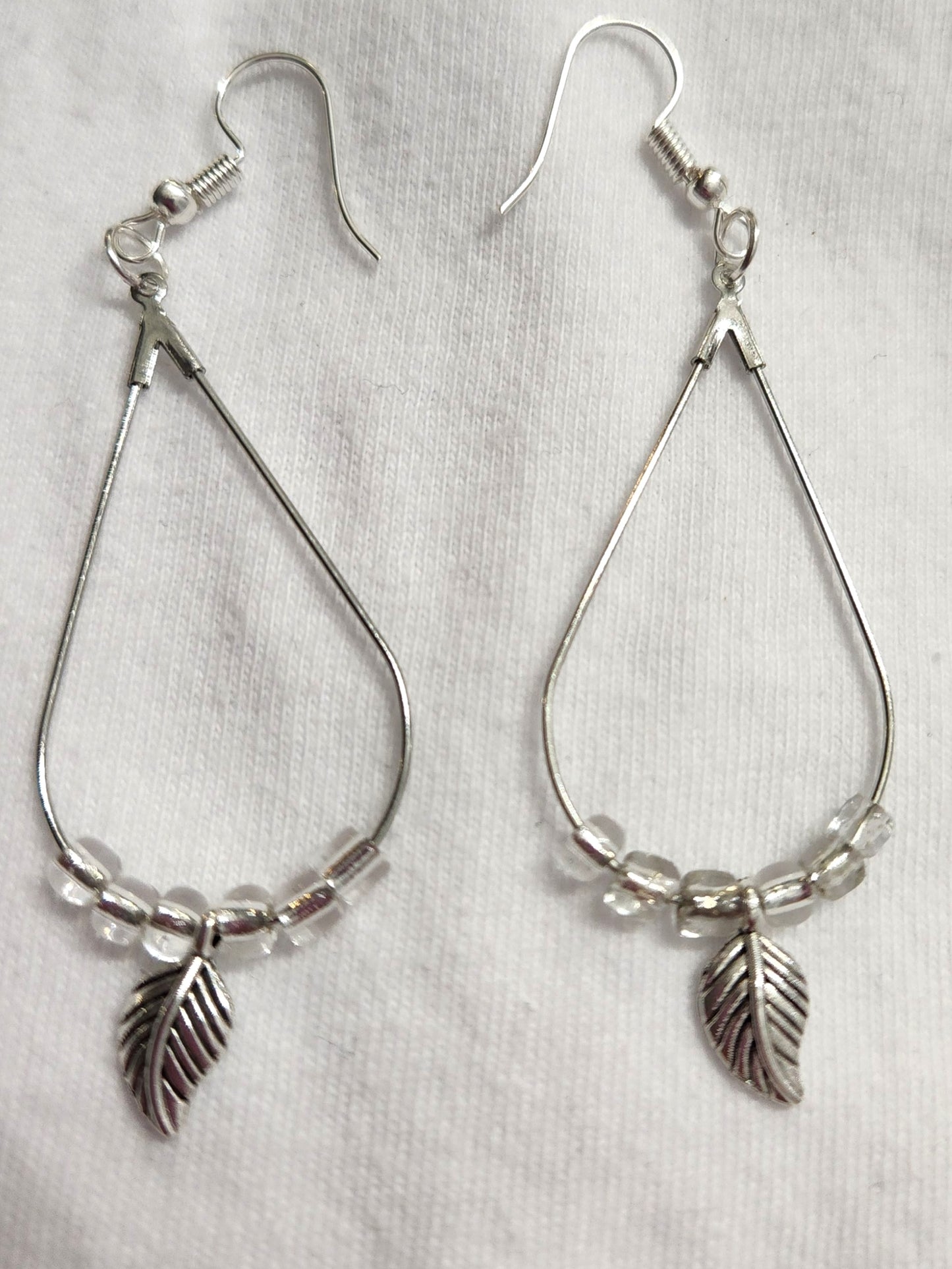 Silver Teardrop Earrings with Feather Charm and Clear Beads